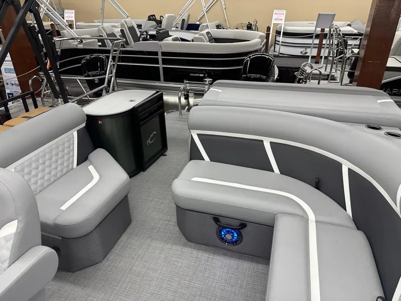 Slide: The Image of 2025 Crest Classic 220 pontoon boat interior with gray seating and modern design. - 10
