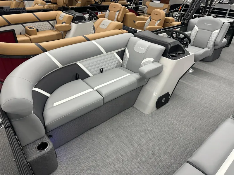 Slide: The Image of 2025 Crest Classic 220 pontoon boat interior with gray seating and modern design. - 2