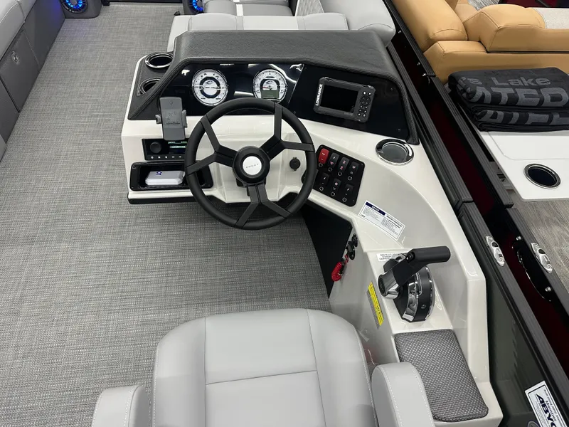 Slide: The Image of 2025 Crest Classic 220 boat dashboard with steering wheel and control panel. - 8