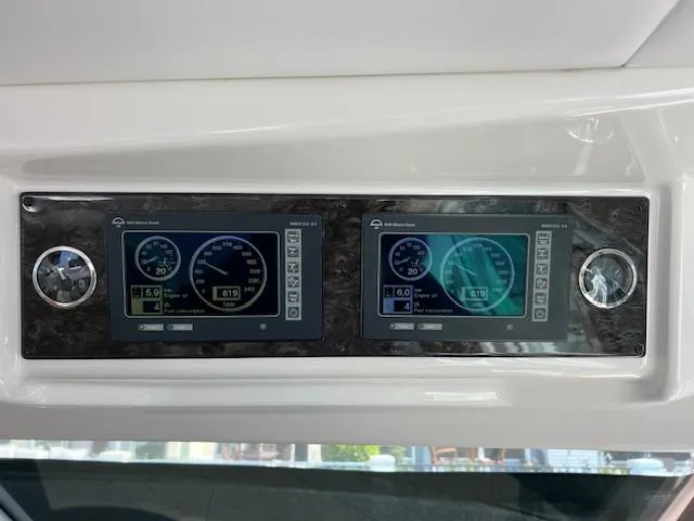 Slide: The Image of Dashboard of 2008 Sea Ray 55 Sundancer with dual digital displays and controls. - 29