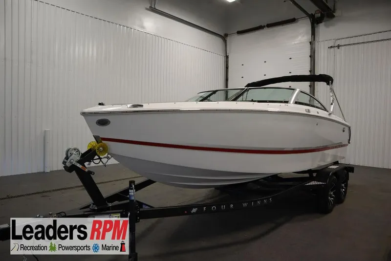 The Image of 2025 Four Winns H1 boat on trailer in indoor showroom. - 0