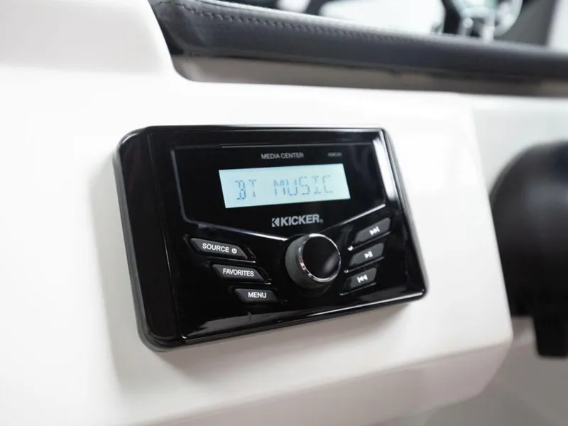 Slide: The Image of 2025 Four Winns H1 boat media center with Kicker audio system displaying "BT Music". - 13