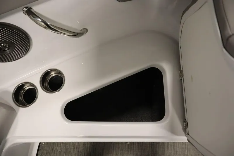 Slide: The Image of Interior of 2025 Four Winns H1 boat, featuring sleek design and cup holders. - 27