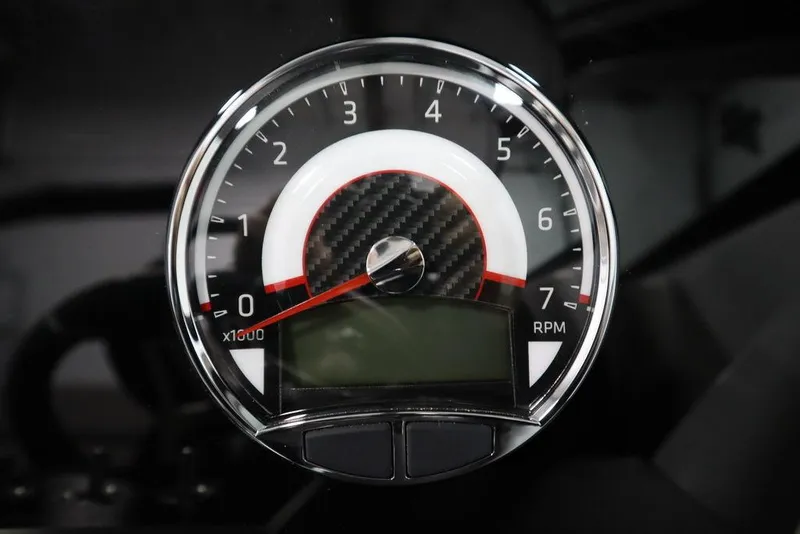 Slide: The Image of Tachometer of 2025 Four Winns H1 boat, displaying RPM with carbon fiber detail. - 28