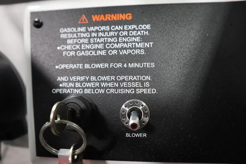 Slide: The Image of Warning label on 2025 Four Winns H1 boat, emphasizing gasoline vapor safety precautions. - 40