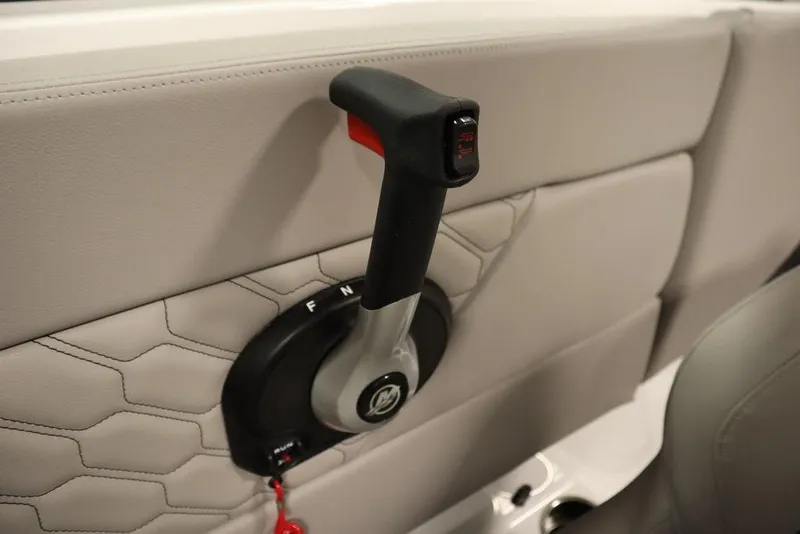 Slide: The Image of Throttle control lever in 2025 Four Winns H1 boat, featuring sleek design and ergonomic handle. - 42