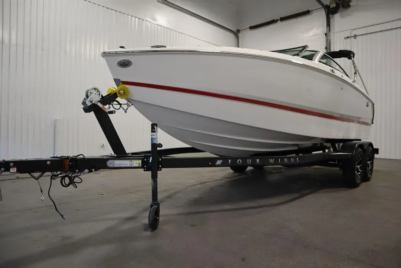 Slide: The Image of 2025 Four Winns H1 boat on trailer in indoor storage facility. - 8