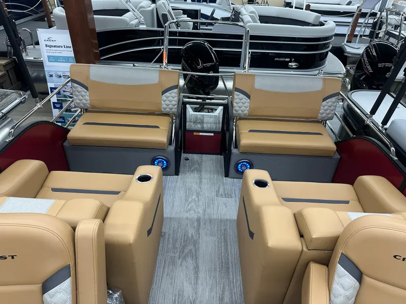 Slide: The Image of Interior of 2025 Crest Classic 220 pontoon boat with tan seating and modern design. - 10