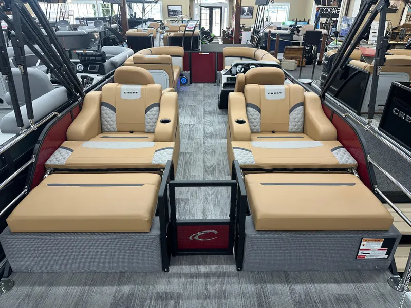Slide: The Image of 2025 Crest Classic 220 pontoon boat interior with tan seating and modern design. - 12