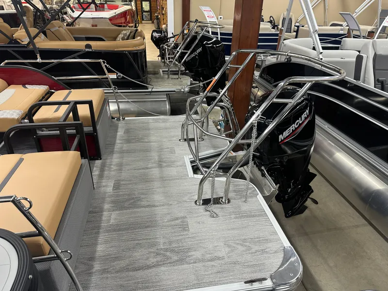 Slide: The Image of 2025 Crest Classic 220 pontoon boat with Mercury outboard motor, featuring spacious seating. - 13