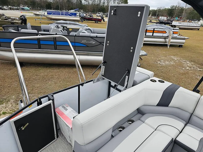 Slide: The Image of 2025 SunCatcher Select 322C pontoon boat interior with seating and storage features. - 10