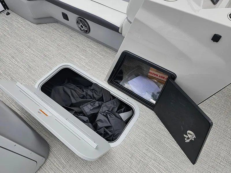 Slide: The Image of 2025 SunCatcher Select 322C storage compartments with open hatches and visible interior items. - 18