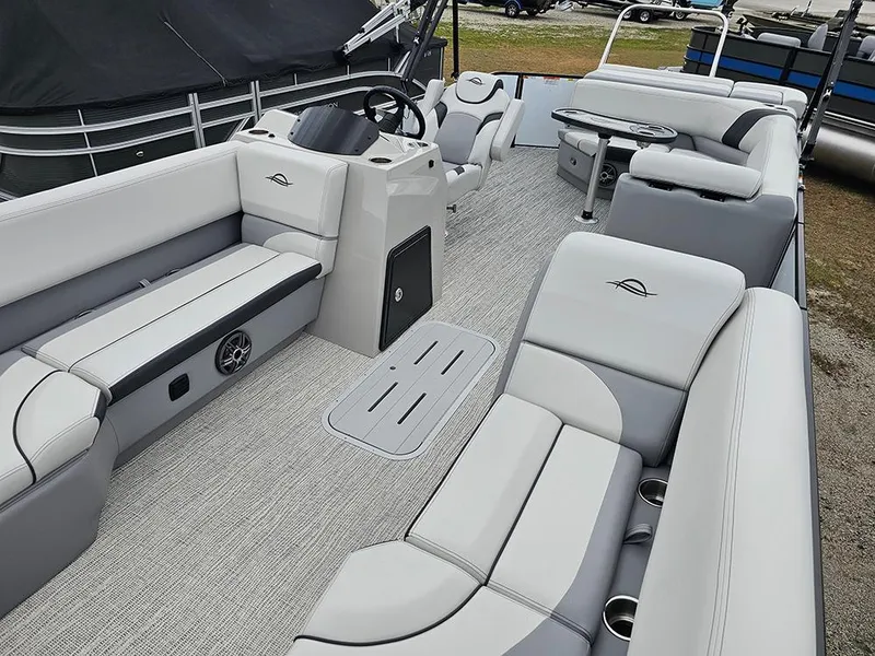 Slide: The Image of 2025 SunCatcher Select 322C pontoon boat interior with plush seating and modern design. - 8