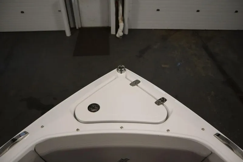 Slide: The Image of Bow of 2025 Four Winns H2 boat in a garage setting. - 13