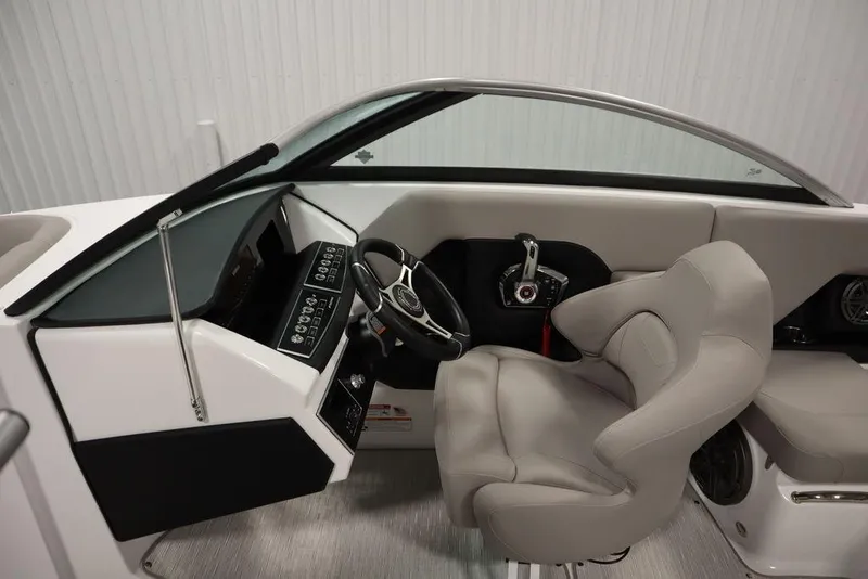 Slide: The Image of Interior of 2025 Four Winns H2 boat featuring modern steering and control panel. - 15