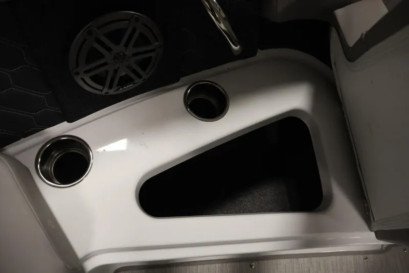 Slide: The Image of Interior of 2025 Four Winns H2 boat with cup holders and speaker. - 17