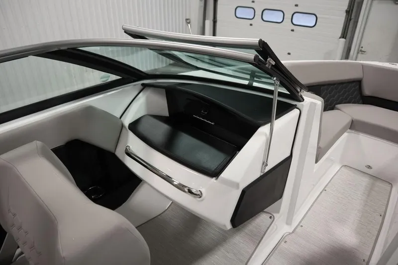 Slide: The Image of 2025 Four Winns H2 boat interior with sleek seating and modern dashboard design. - 21