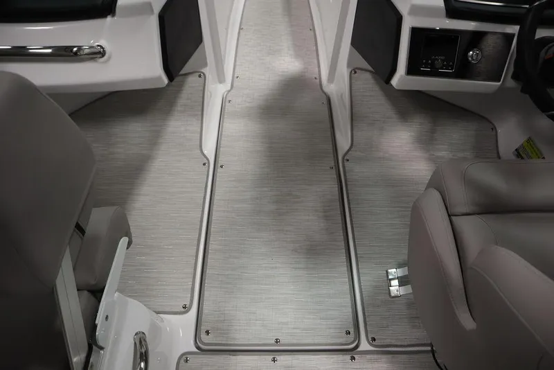 Slide: The Image of Interior of 2025 Four Winns H2 boat, featuring sleek seating and modern design. - 25