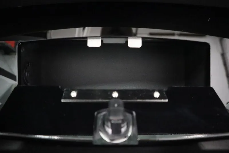 Slide: The Image of 2025 Four Winns H2 boat interior detail with sleek black finish and metallic accents. - 34