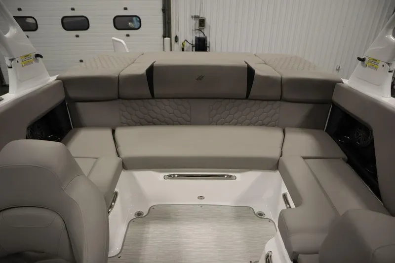 Slide: The Image of 2025 Four Winns H2 boat interior with gray cushioned seating and modern design. - 36