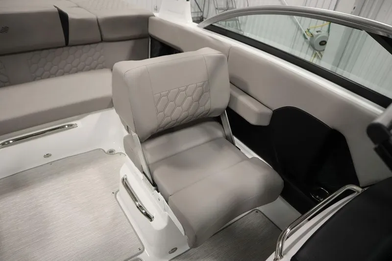 Slide: The Image of 2025 Four Winns H2 boat interior with gray seating and modern design. - 40