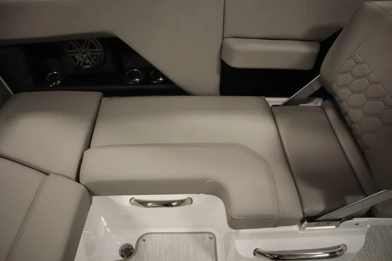 Slide: The Image of 2025 Four Winns H2 boat interior with gray seating and cup holders. - 42