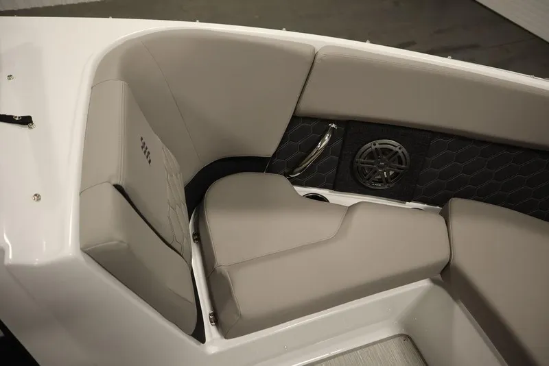 Slide: The Image of 2025 Four Winns H2 boat interior with gray seating and speaker detail. - 9