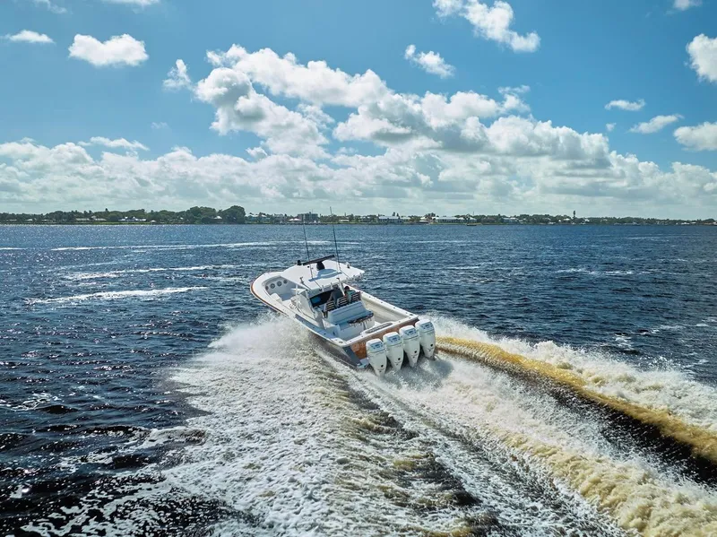 Slide: The Image of 2020 Valhalla Boatworks 41 cruising on open water under a bright blue sky. - 18