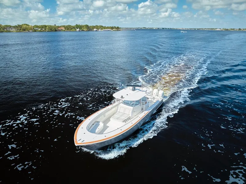 Slide: The Image of 2020 Valhalla Boatworks 41 cruising on open water under a partly cloudy sky. - 20