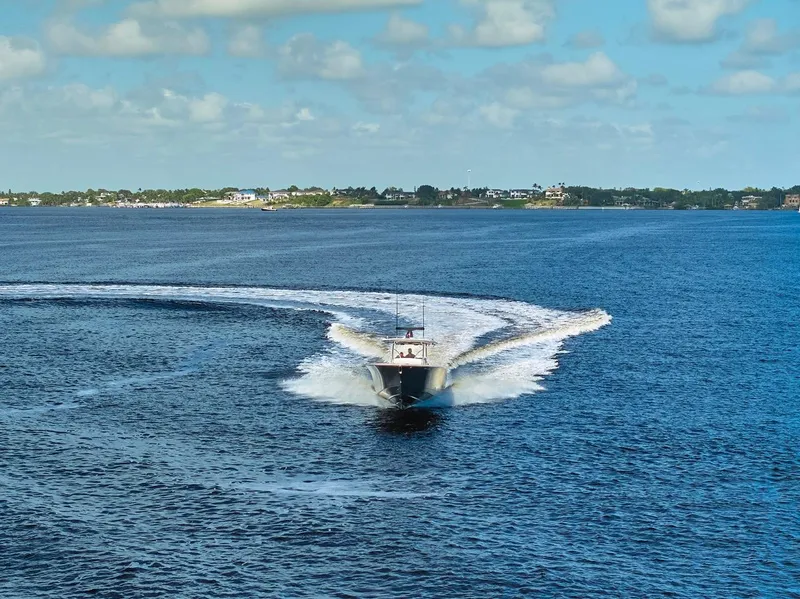 Slide: The Image of 2020 Valhalla Boatworks 41 cruising on open water under a blue sky. - 21