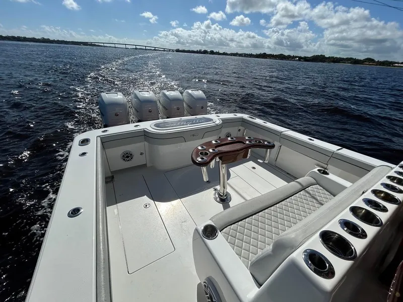 Slide: The Image of 2020 Valhalla Boatworks 41 on water, featuring spacious deck and multiple outboard engines. - 27