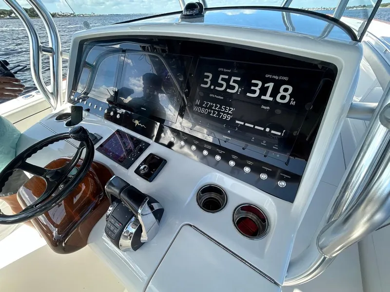 Slide: The Image of 2020 Valhalla Boatworks 41 dashboard with navigation display and controls. - 30