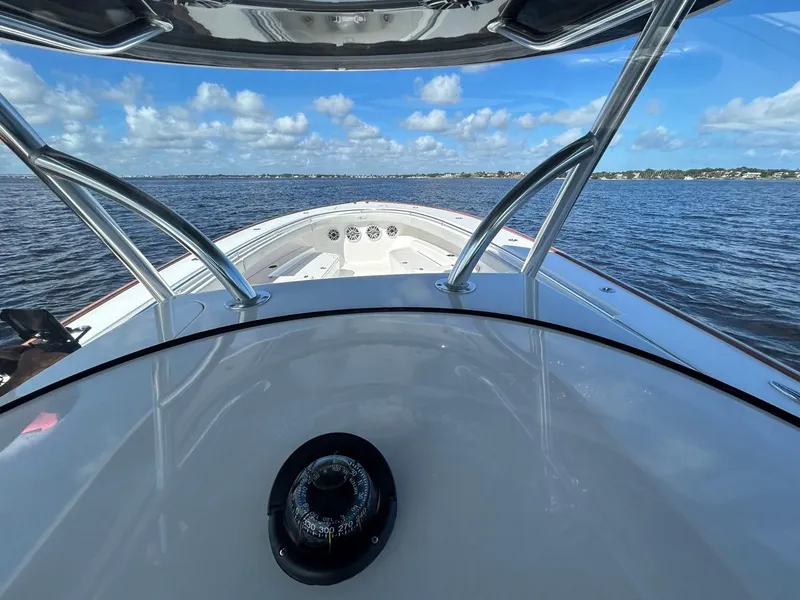 Slide: The Image of Valhalla Boatworks 41, 2020 model, cruising on a calm blue sea under a clear sky. - 31