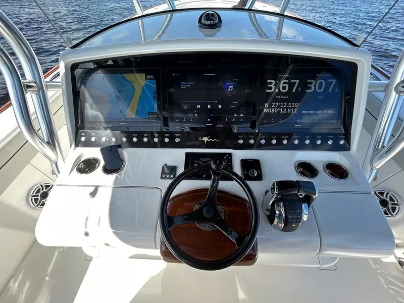 Slide: The Image of Helm of 2020 Valhalla Boatworks 41 with advanced navigation displays and controls. - 32