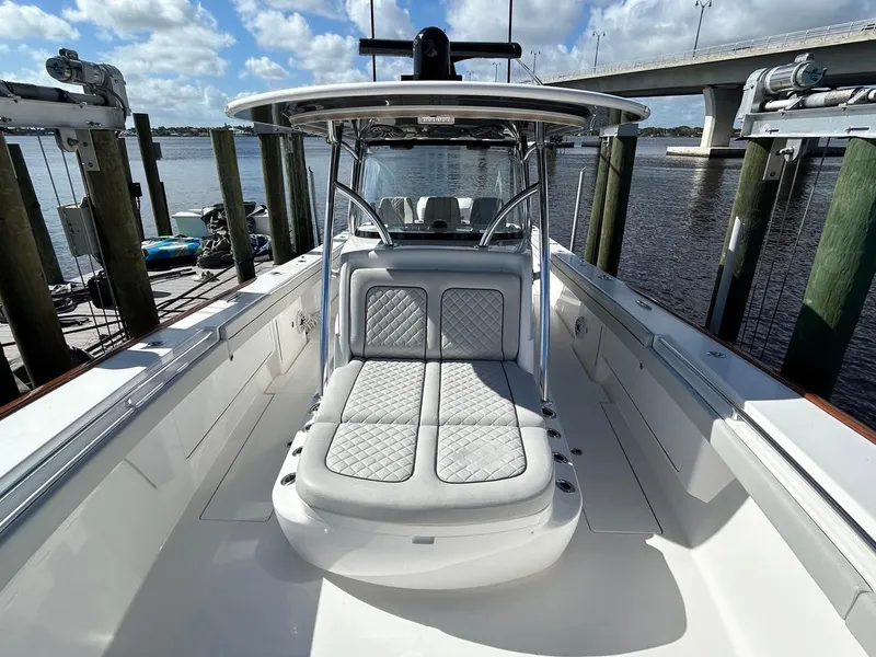 Slide: The Image of 2020 Valhalla Boatworks 41, sleek design, spacious deck, luxury seating, docked by a scenic waterfront. - 37
