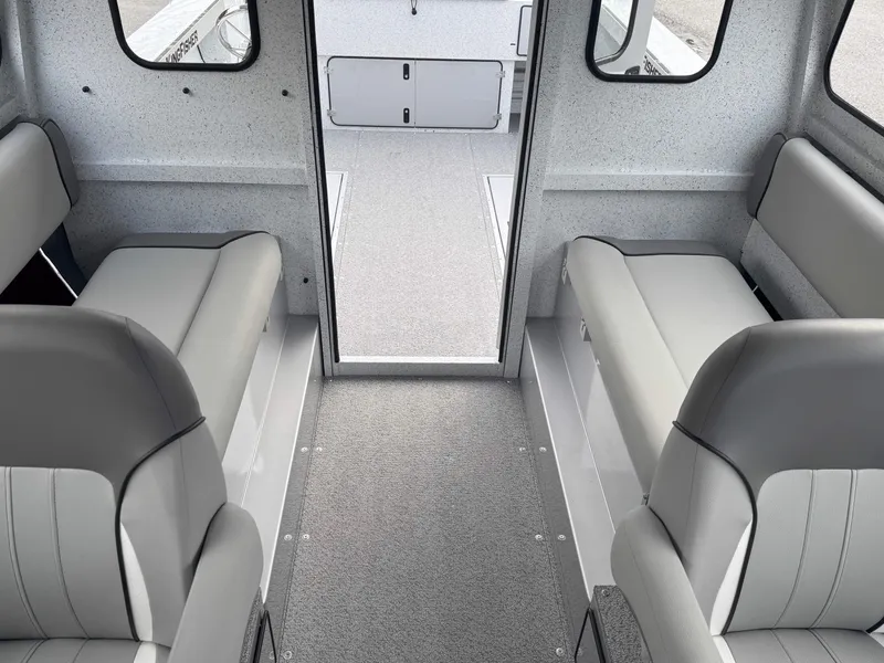 Slide: The Image of Interior of 2025 KingFisher 2625 Coastal Express boat with gray seating and carpet. - 4