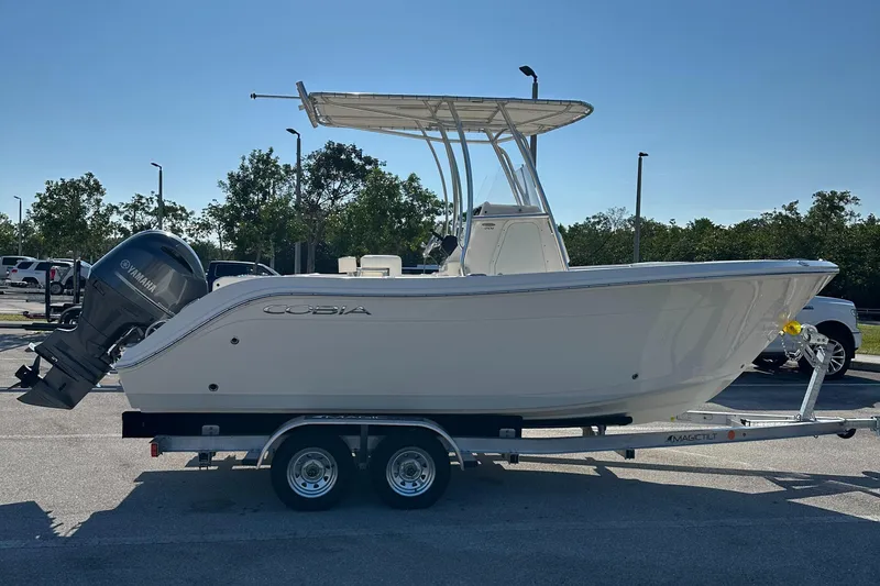 Slide: The Image of 2022 Cobia 201 Center Console boat on trailer, side view. - 5