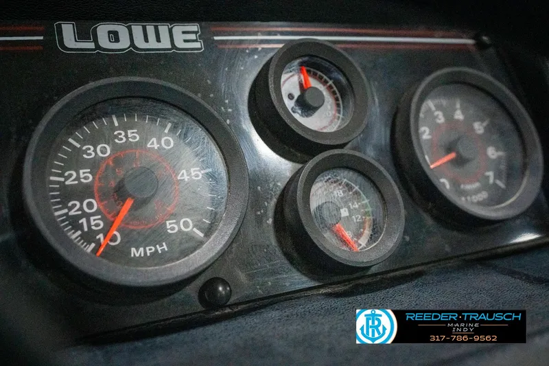 Slide: The Image of Dashboard of a 1990 Lowe 1700 boat with speedometer and gauges. - 30