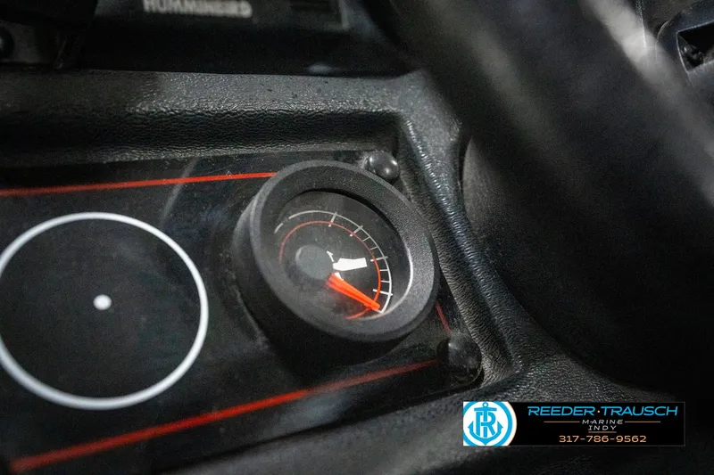 Slide: The Image of Dashboard gauge of a 1990 Lowe 1700 boat, featuring a speedometer. - 31