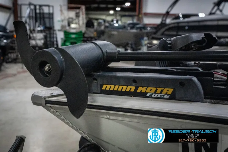 Slide: The Image of Minn Kota Edge trolling motor on a 1990 Lowe 1700 boat in a workshop. - 37