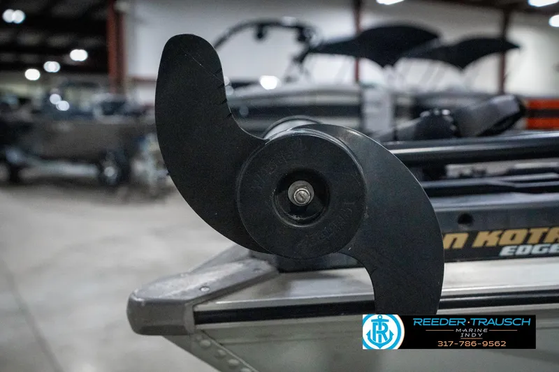 Slide: The Image of Close-up of a 1990 Lowe 1700 boat propeller in a showroom setting. - 39