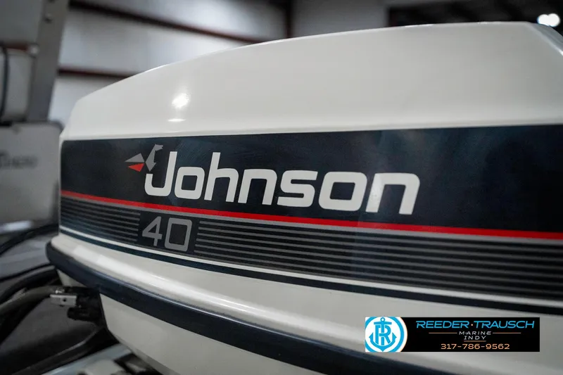 Slide: The Image of Johnson 40 outboard motor on a 1990 Lowe 1700 boat, Reeder-Trausch Marine logo visible. - 41