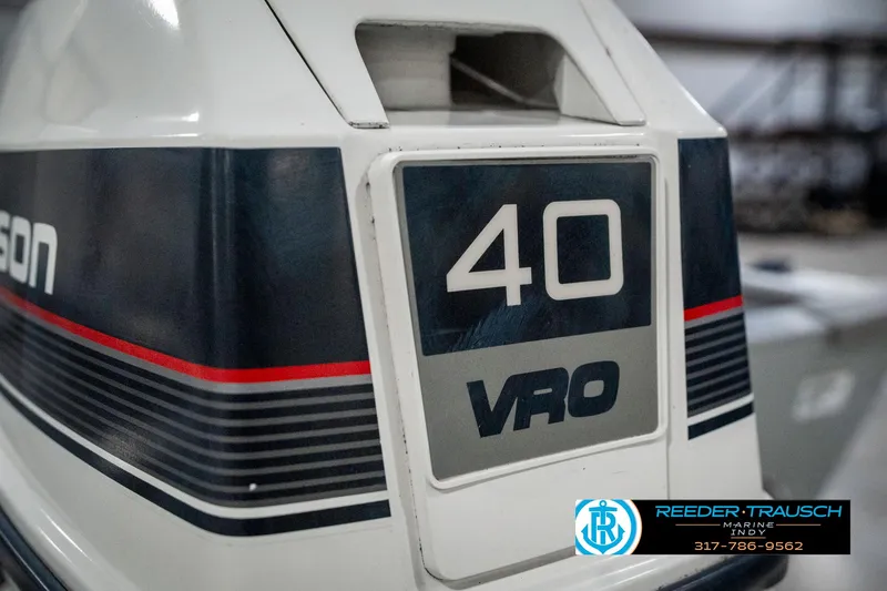 Slide: The Image of 1990 Lowe 1700 outboard motor, 40 VRO, with blue and red stripes. - 42