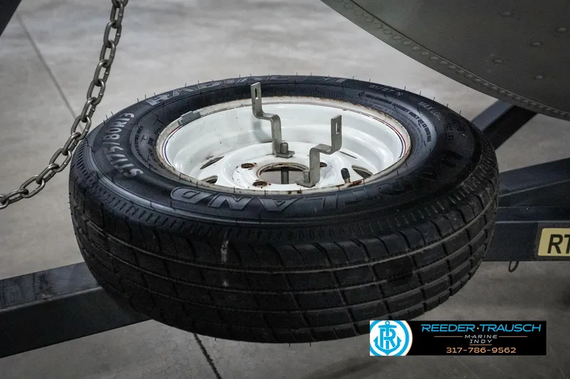 Slide: The Image of Spare tire mounted on a Lowe 1700 trailer, 1990 model. - 46