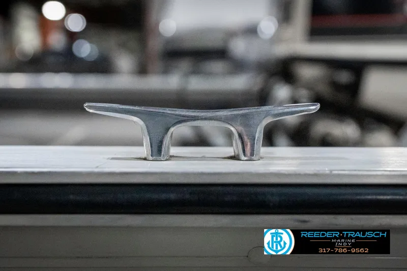 Slide: The Image of Close-up of a metal cleat on a 1990 Lowe 1700 boat. - 47
