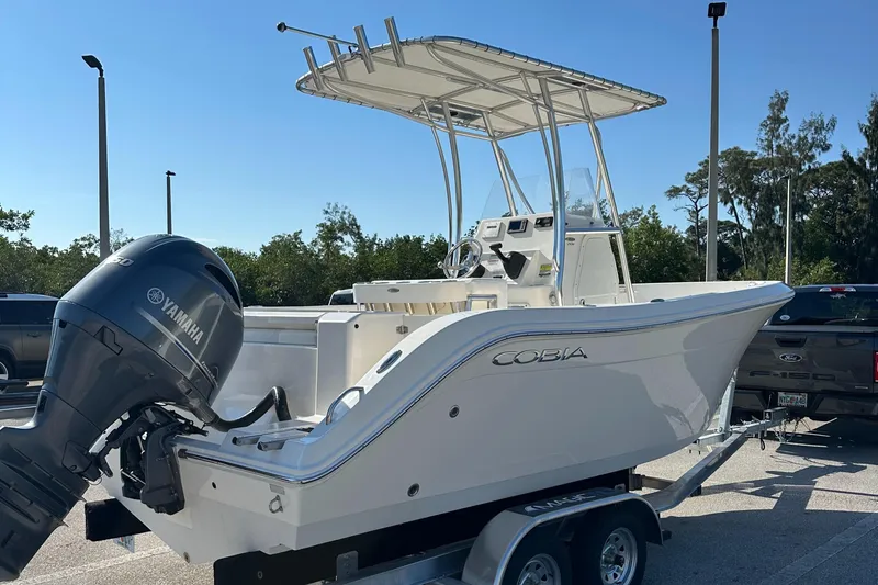 Slide: The Image of 2022 Cobia 201 Center Console boat on trailer with Yamaha outboard motor. - 4