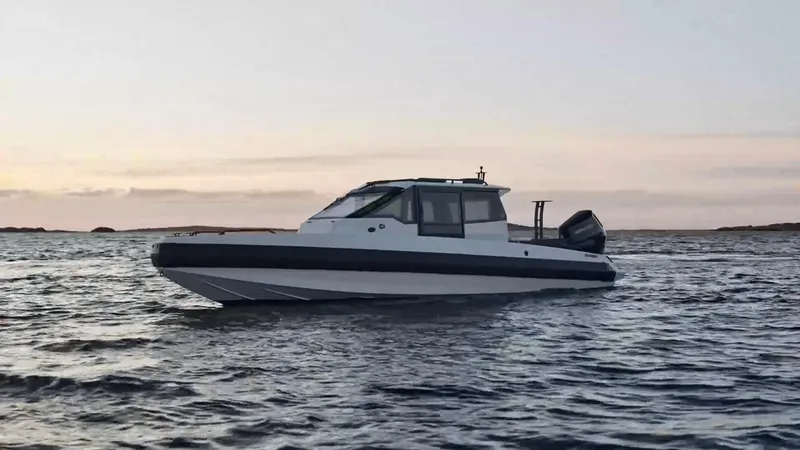 Slide: The Image of 2025 Iron 827C boat on calm water at sunset. - 8
