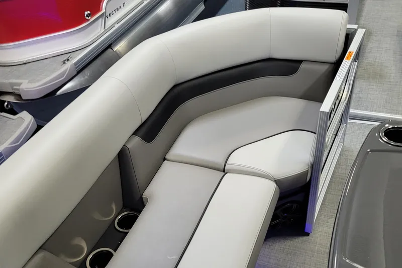 Slide: The Image of Luxurious seating on 2025 Princecraft Vectra 21 RL pontoon boat, featuring sleek design and cup holders. - 10