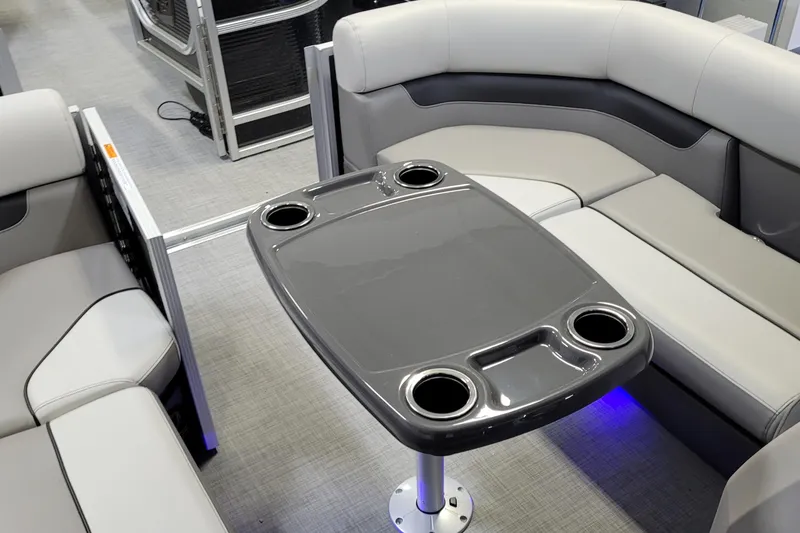 Slide: The Image of 2025 Princecraft Vectra 21 RL interior with sleek seating and modern table design. - 11