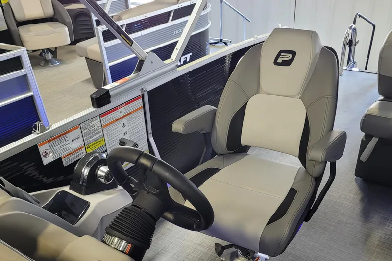 Slide: The Image of 2025 Princecraft Vectra 21 RL boat interior with steering wheel and captain's chair. - 6